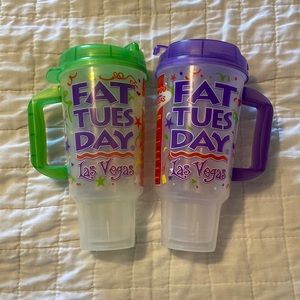 Set of two Fat Tuesday drink cups with handles.